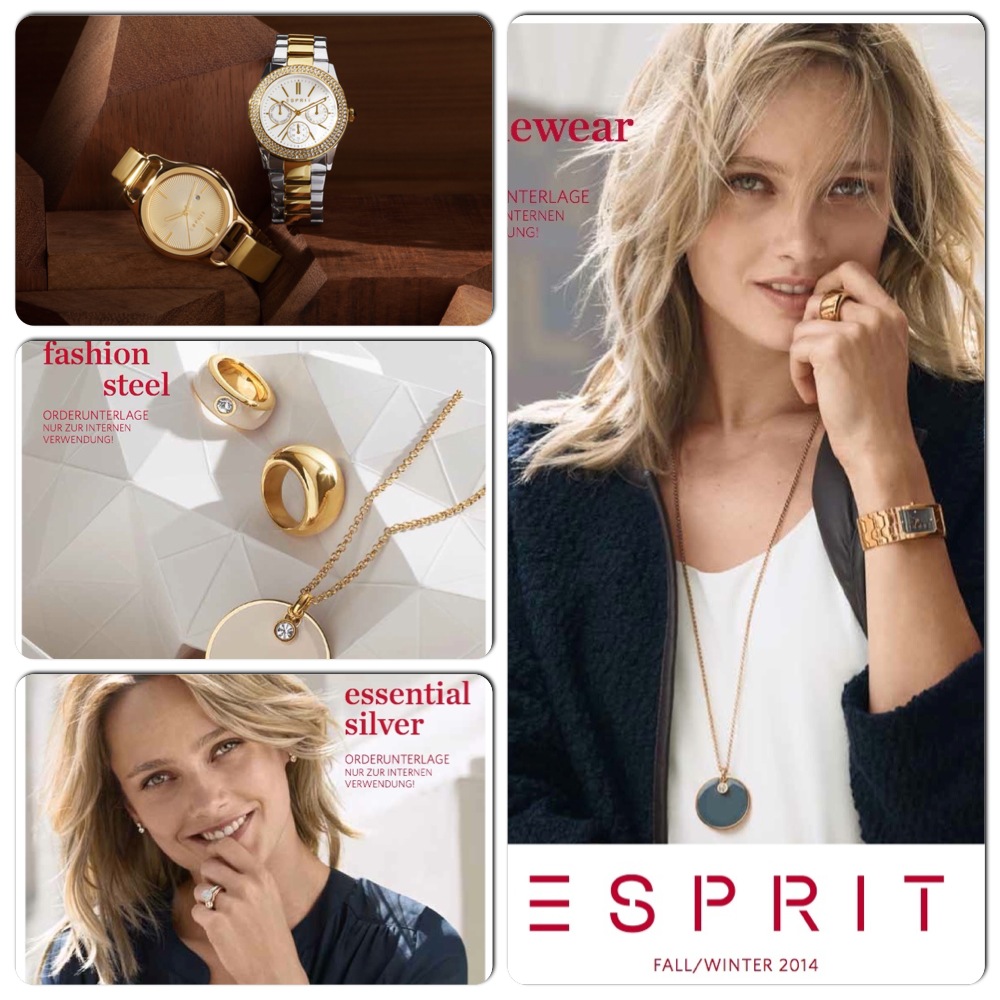 Verschiedene Schmuckstücke, darunter Uhren und Ringe, auf holzigem Hintergrund.