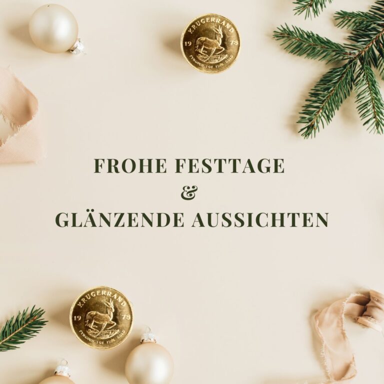 Weihnachtliche Dekoration mit einer goldenen Münze und frohen Sprüchen.